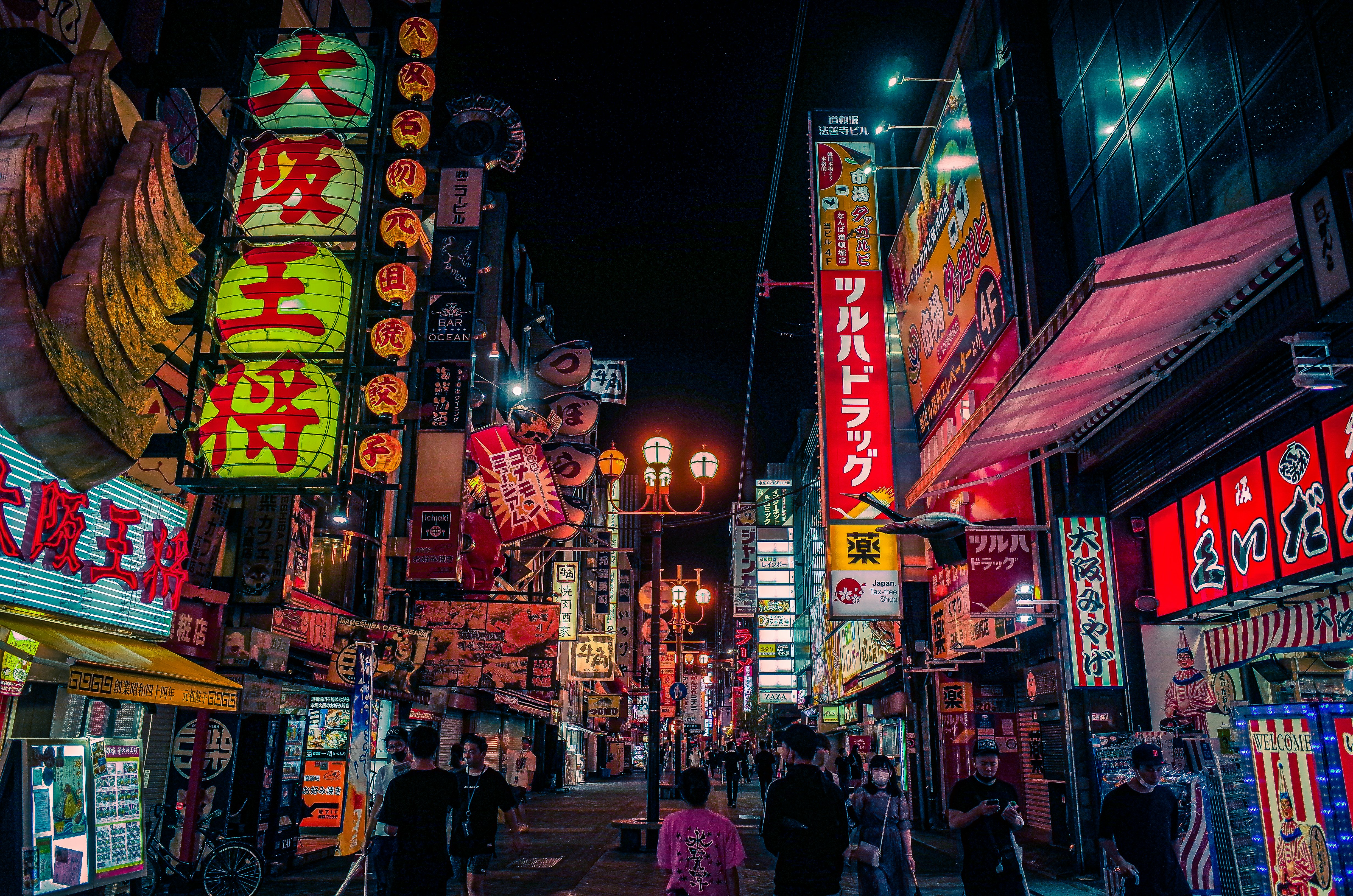 people walking on street during nighttime